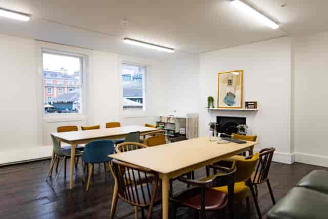 Versatile meeting space with natural light, ideal for workshops and team meetings.