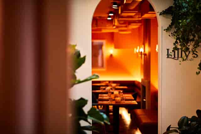 Lilly's Cafe: cozy venue with soft lighting for intimate gatherings and corporate events.
