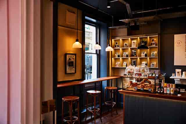 Stylish café with warm lighting, ideal for networking events and casual meetings.