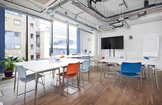 Modern meeting space at Wallacespace Clerkenwell with colorful chairs for workshops.