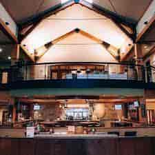 Spacious ballroom with vaulted ceiling for events and meetings at Pinstripes South Barrington.