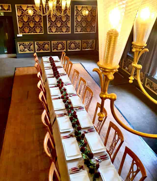 Elegant dining table in Garrison Tavern ballroom for formal events and corporate meetings.