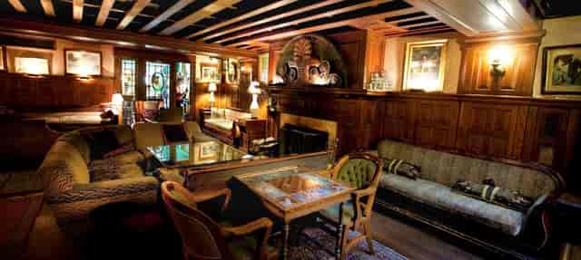 Cozy lounge in Tabard Inn Room 51, perfect for meetings and networking events.