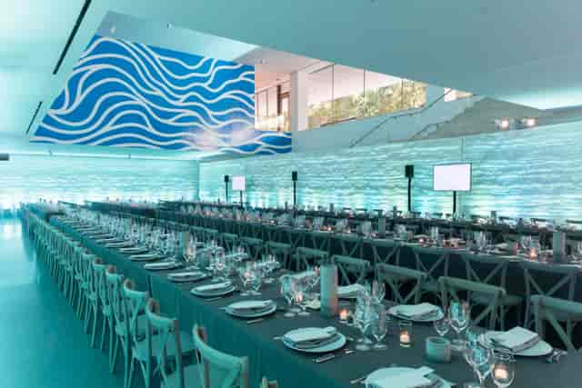 Elegant dining setup for corporate gala at San Francisco Museum of Modern Art.