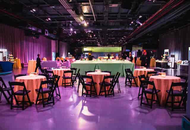 Hangar deck at Intrepid Museum, elegant tables set for networking events and gatherings.