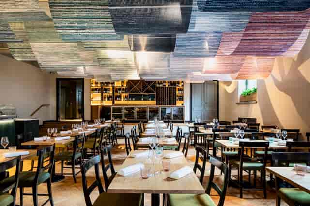 Stylish restaurant interior with unique ceiling, ideal for intimate gatherings and corporate events.