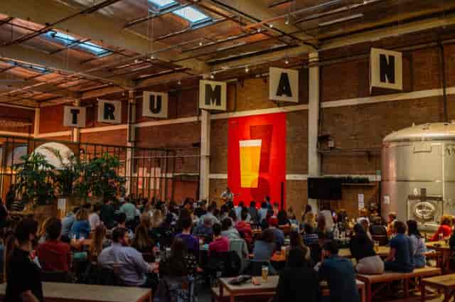 Vibrant event space at Big Penny Social with industrial decor for networking and gatherings.