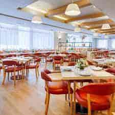 Modern restaurant interior at Fig & Olive DC, ideal for events and gatherings.