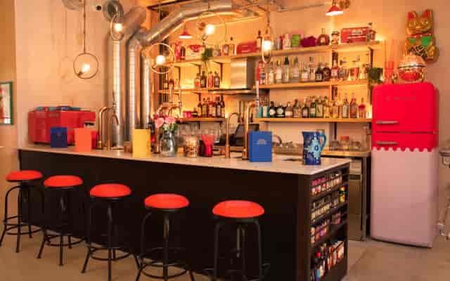 Vibrant bar area in Open Plan Living Room, ideal for networking events and gatherings.