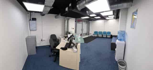 Modern meeting space with blue carpet, ideal for events and gatherings at D&S Support Center.