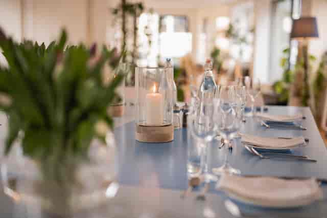 Elegant dining table with flowers at Clerkenwell Kitchen for corporate events.