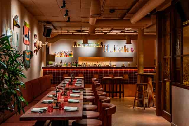 Sala Rosa Room in Fonda: vibrant dining space for intimate gatherings and cocktail receptions.