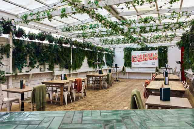 The Secret Garden at The Exhibit Balham: green-filled, naturally lit corporate event venue.