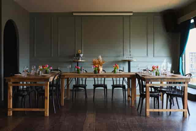 U-shaped banquet setup at The Exhibit Balham for private dining or corporate meetings.