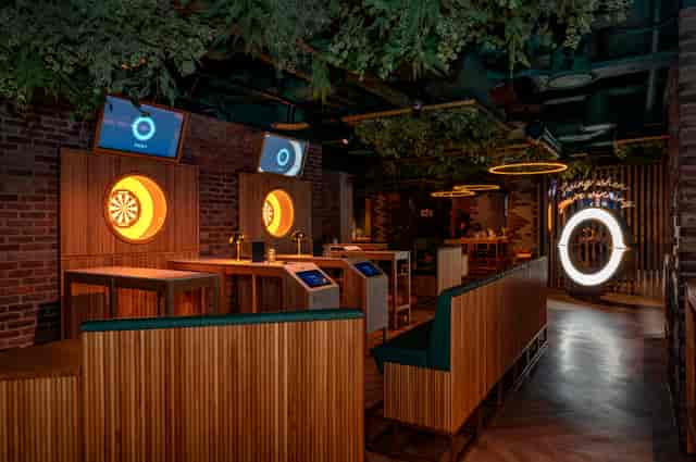 Modern event space with wood accents for team-building and social mixers in Oche The Strand.