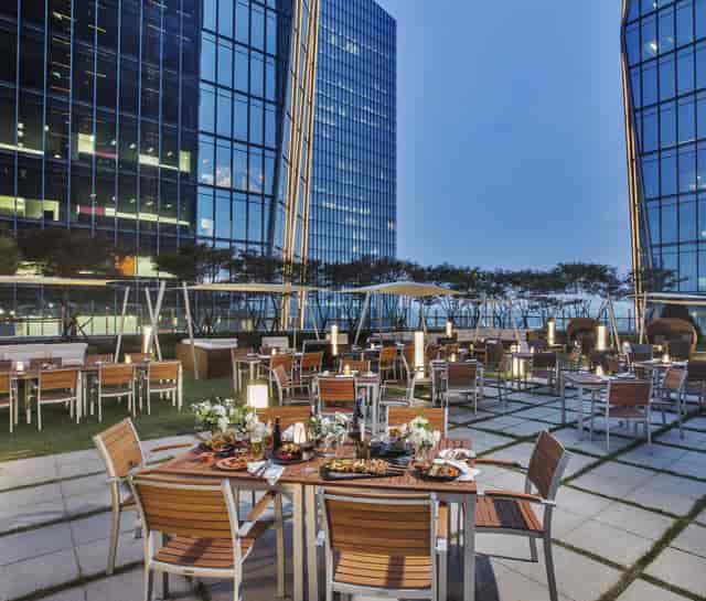 Stylish outdoor event space in Conrad Seoul, ideal for corporate gatherings and cocktail parties.