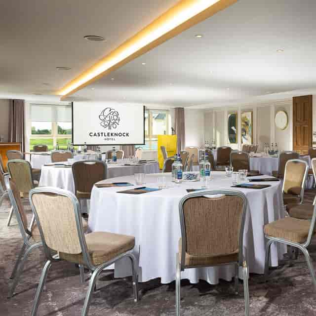Castleknock Suite meeting room with round tables, ideal for corporate events and conferences.