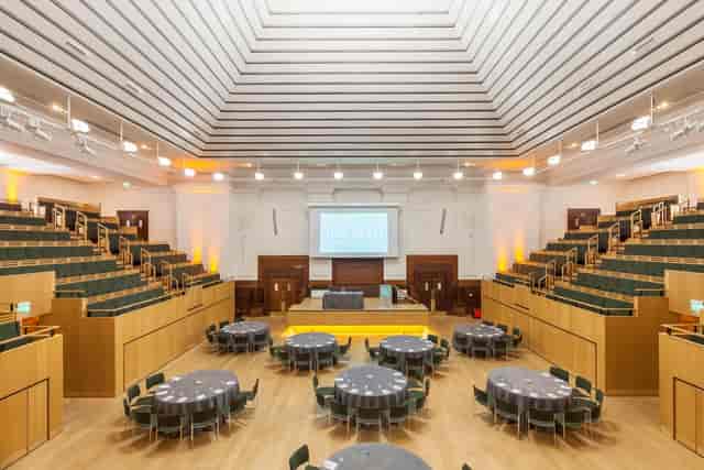 Versatile event space with tiered seating for meetings and social gatherings.