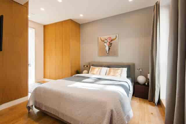 Luxury hotel room at Charing Cross, ideal for events and relaxation.