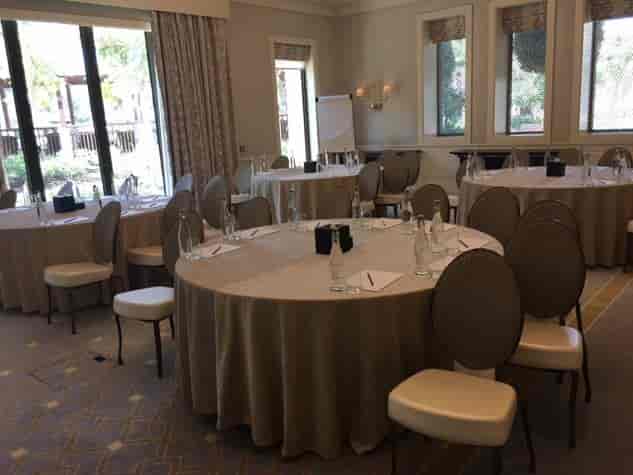 Jawharah Room at Four Seasons Dubai, round tables set for meetings and workshops.
