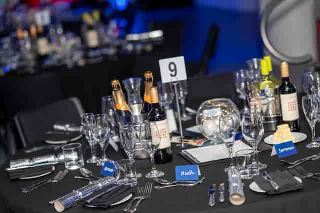 Elegant Christmas banquet table at Millennium Point with champagne centerpieces.