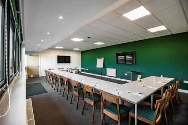 Captain's Lounge at Home Park Stadium: modern meeting room with natural light, ideal for events.