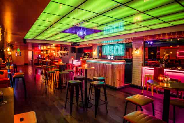 Vibrant event space with modern bar for networking and social gatherings in Leicester Square.
