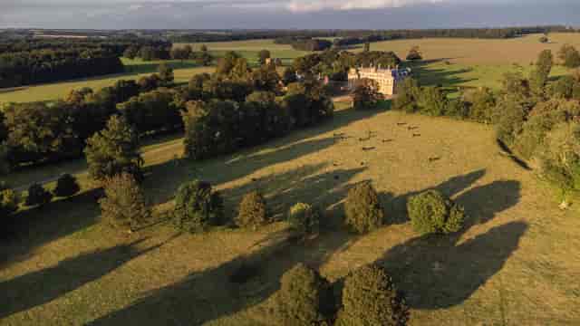 Raynham Park venue with green fields, ideal for outdoor events and gatherings.