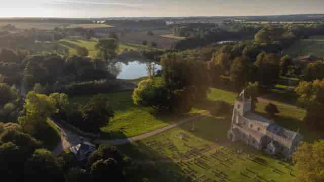 Raynham Park venue with charming church, ideal for weddings and outdoor events.