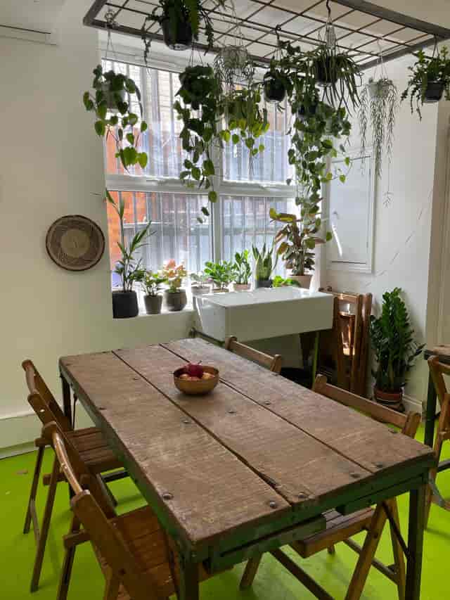Cozy meeting space with rustic table, ideal for intimate gatherings and brainstorming sessions.