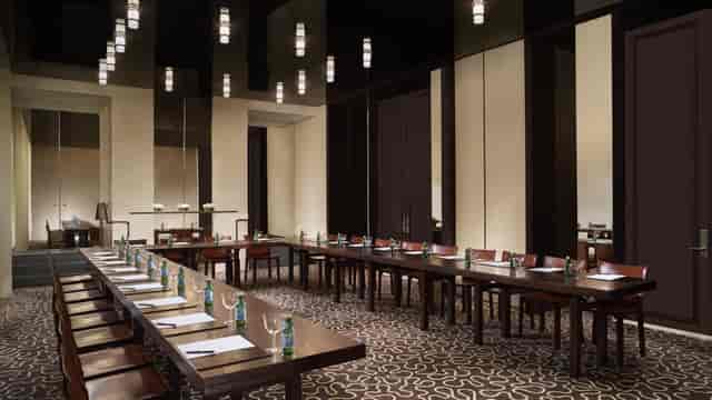 Junior Ballroom at Ritz Carlton Singapore, elegant table setup for meetings and workshops.