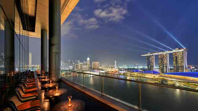 Elegant rooftop venue Vue Singapore with city skyline, perfect for upscale events.