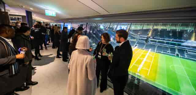 Networking event at Tottenham Hotspur Stadium with stunning field views.