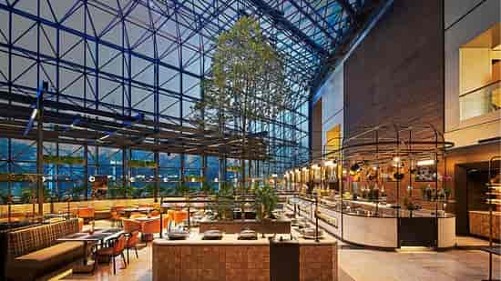 Skai Restaurant in Singapore: modern venue with glass ceiling for events and meetings.