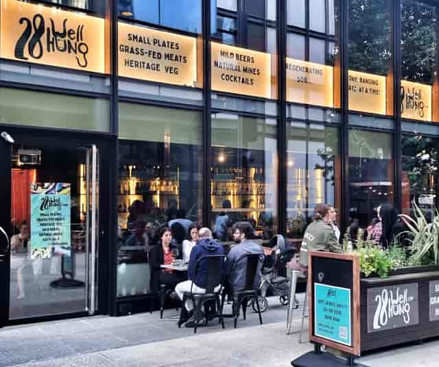 Vibrant outdoor dining venue with modern decor, ideal for networking events and gatherings.