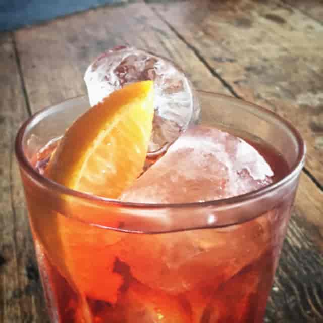 Craft cocktail with vibrant garnishes at Crol and Co, perfect for events and receptions.