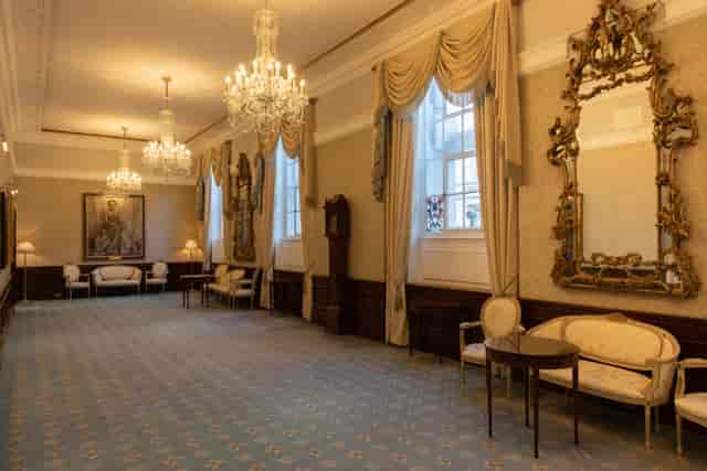 Elegant reception room in Carpenter's Hall with ornate chandeliers, ideal for events.