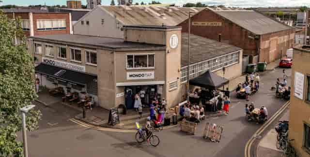Vibrant Mondo Brewing Company venue with industrial decor for social events and gatherings.