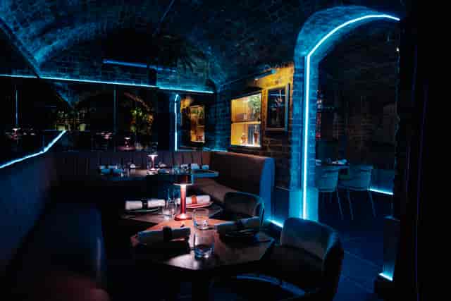 VIP event space in Cache Cache with stylish lighting and modern décor for upscale gatherings.