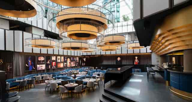 Elegant Radisson Collection Hotel foyer with chandeliers, perfect for events and gatherings.
