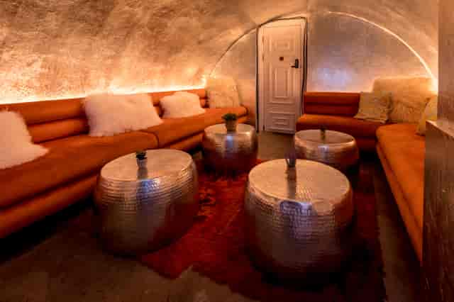 Intimate lounge at The Vault, featuring plush seating for networking events.