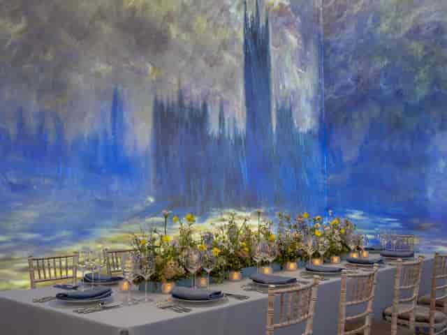 Elegant dining table with floral centerpieces for upscale gala dinners.