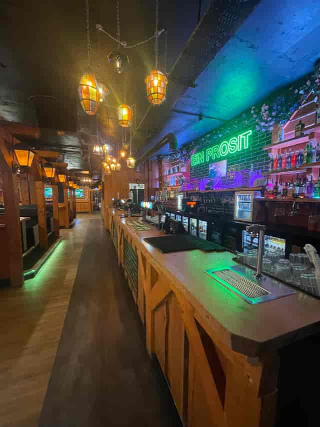 Vibrant bar at Barbara's Bier Haus, perfect for events with rustic decor and warm lighting.