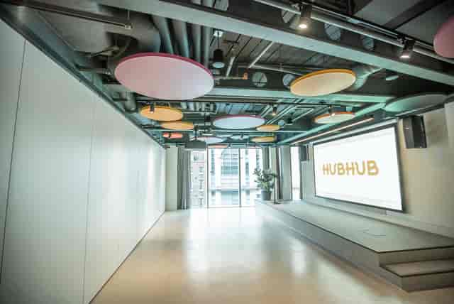 Modern event space with vibrant acoustic panels for meetings and workshops.