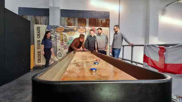 Team-building activity in The Mezzanine at dISruption Brewery, fostering collaboration and engagement.