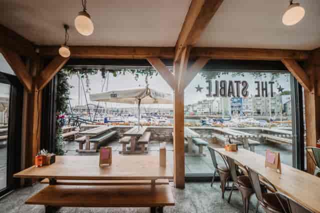 Harbour View Conservatory with wooden beams, ideal for networking events and gatherings.