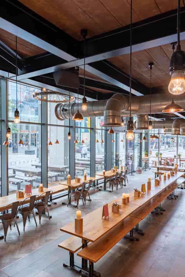 Modern venue with large windows for networking events in The Cardiff Stable.
