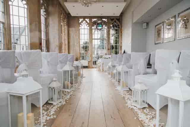 Elegant wedding venue with floral accents and natural light at The Orangery, Foxhills.