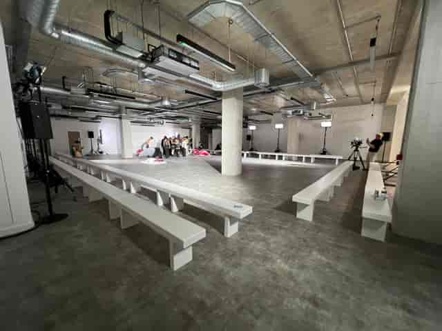 Industrial fashion show event space at THE BLOCK with exposed ceilings and minimalist seating.