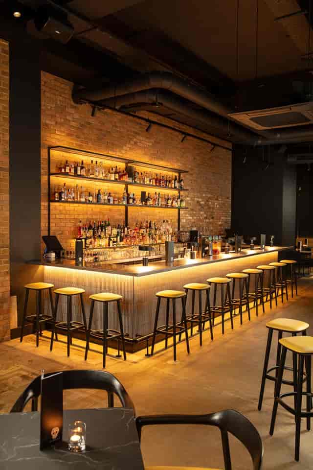 Modern bar at temper Shoreditch with sleek lighting, ideal for networking and social events.